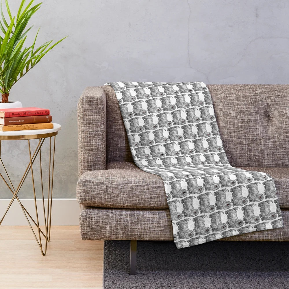 Komondor-inspired plush blanket with ropey, fluffy texture