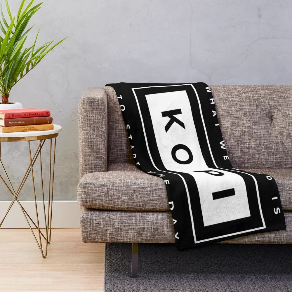 Cozy Kopi-themed plush blanket for coffee enthusiasts