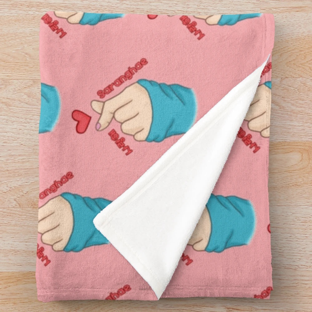 Cozy plush blanket featuring a finger heart design and Korean text "saranghae