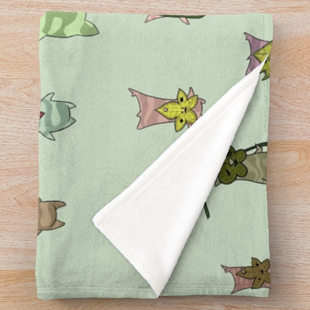 Korok-themed plush blanket with a whimsical pattern and soft, cuddly texture
