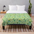 Plush green and brown korok pattern blanket inspired by The Legend of Zelda video game series