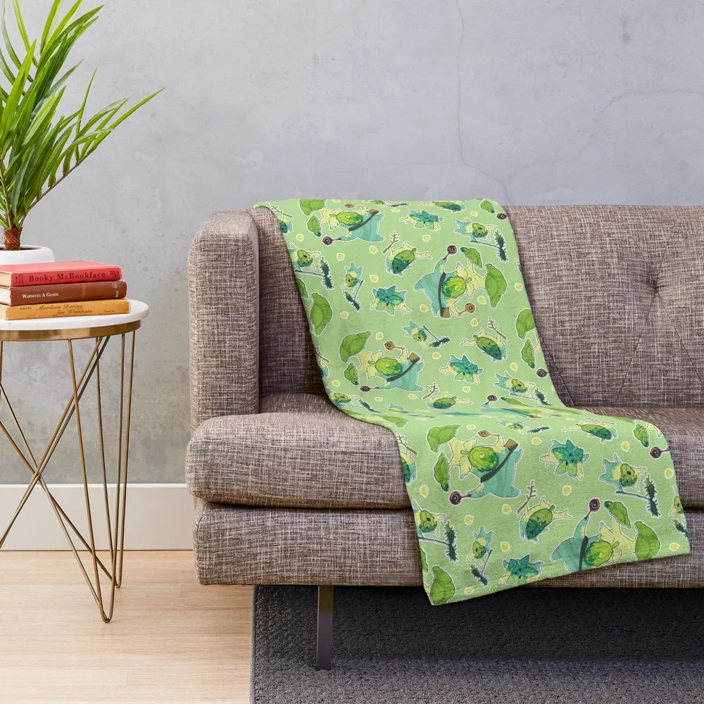 Plush green and brown korok pattern blanket inspired by The Legend of Zelda video game series