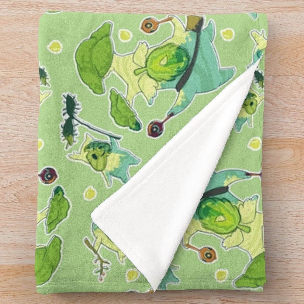 Plush green and brown korok pattern blanket inspired by The Legend of Zelda video game series