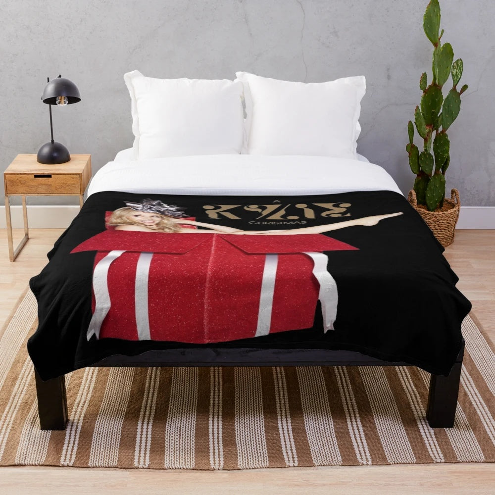 Festive red plush blanket with Kylie Minogue-inspired design