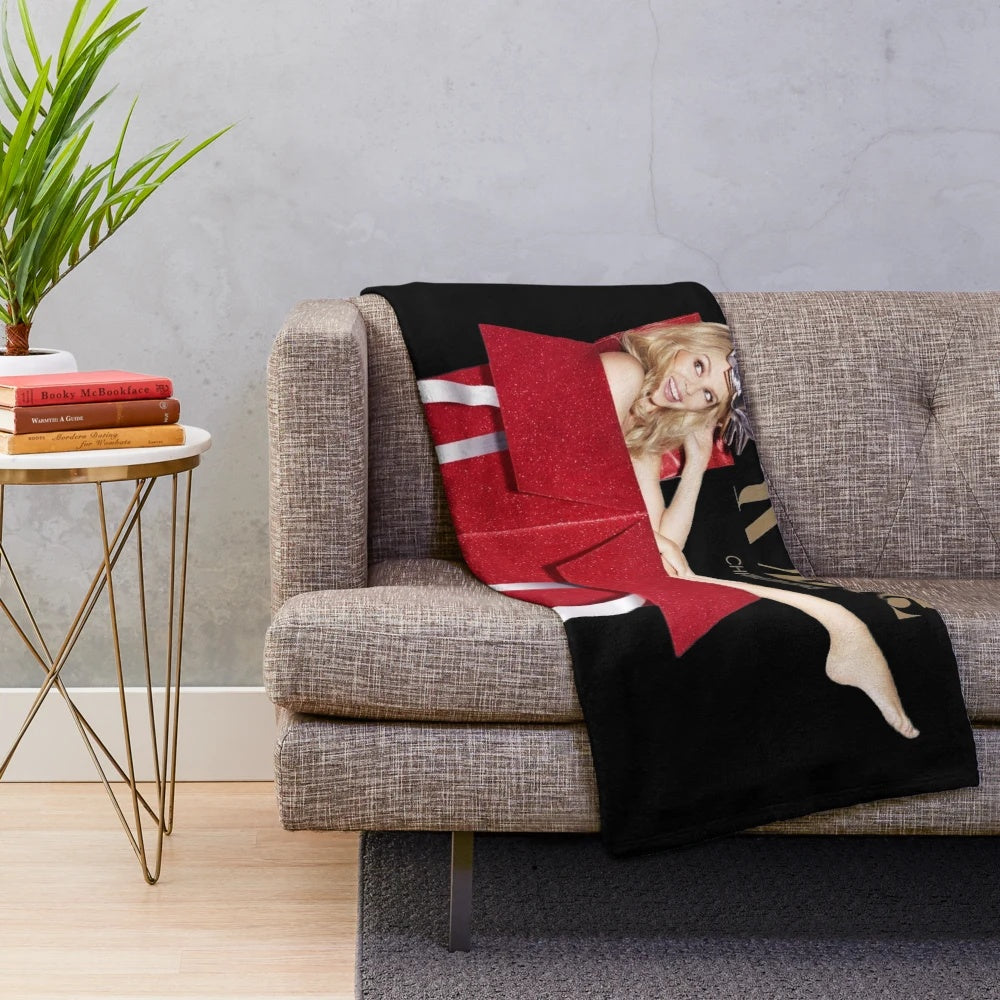 Festive red plush blanket with Kylie Minogue-inspired design