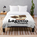 Lagotto Romagnolo dog breed on a plush blanket