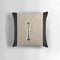 A decorative pillow featuring a sketch of a lamp post, inspired by the Chronicles of Narnia series.