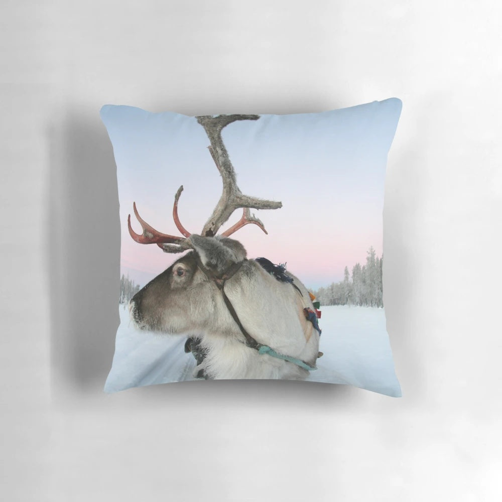 Soft and fluffy Lapland reindeer pillow with a snowy winter design