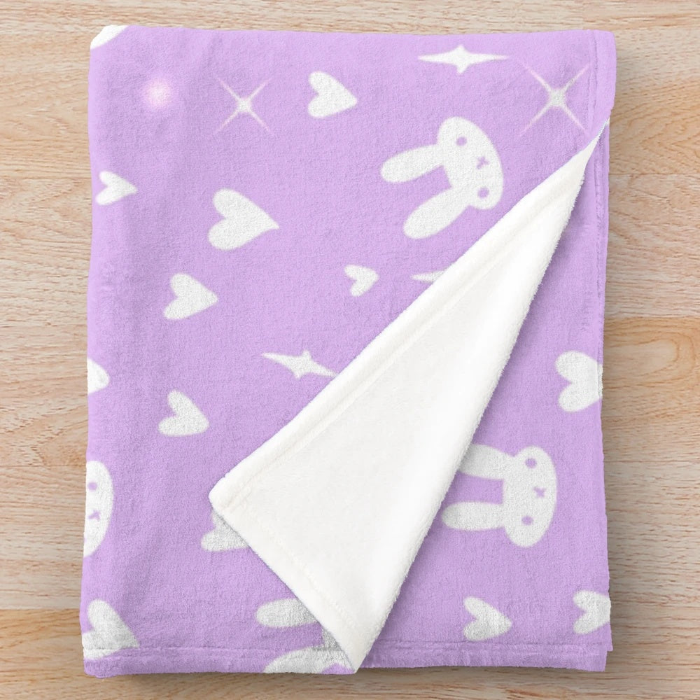 Purple plush bunny blanket with a soft, fluffy design
