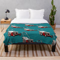 Plush blanket featuring a lawnmower design for tractor and farming enthusiasts