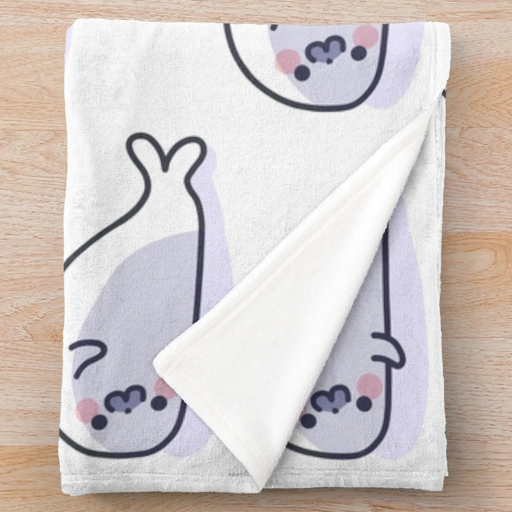 Soft and cuddly plush blanket featuring a lazy, cute seal design