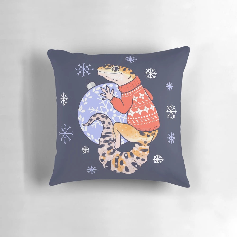Adorable leopard gecko wearing a festive sweater on a plush winter pillow