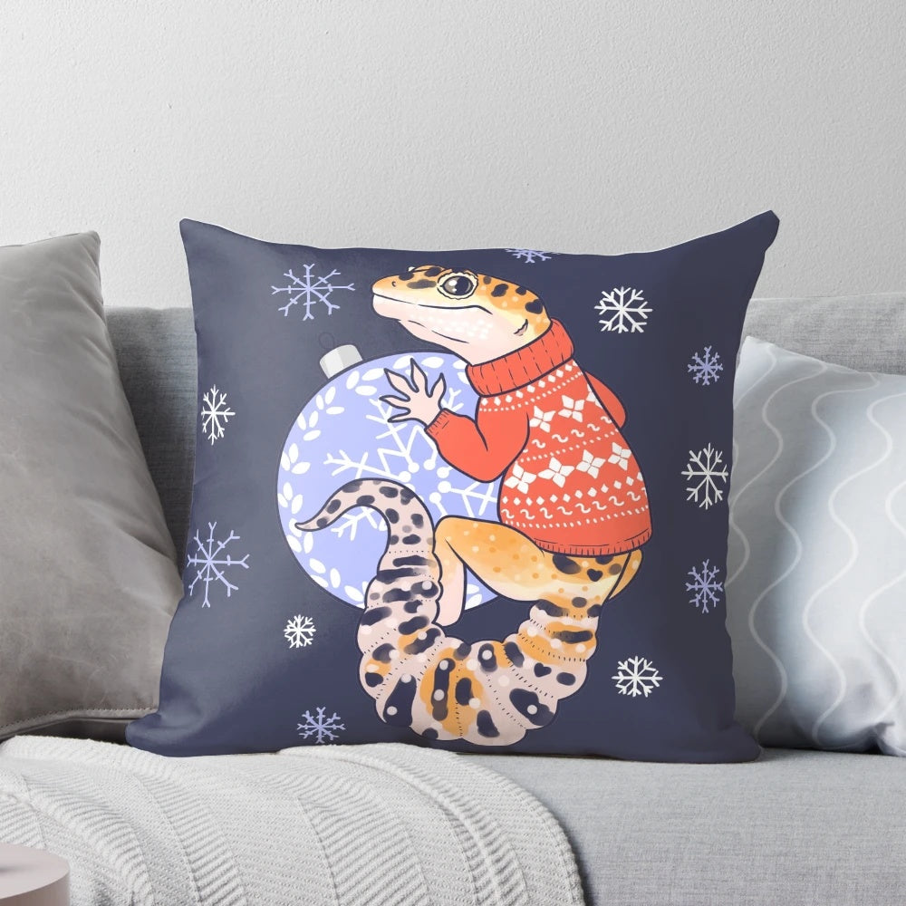 Adorable leopard gecko wearing a festive sweater on a plush winter pillow