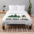 Upper Skagit Library-themed plush blanket with cozy library decor