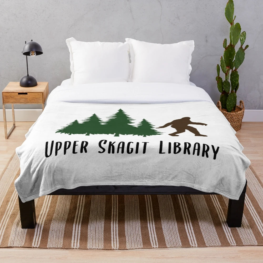 Upper Skagit Library-themed plush blanket with cozy library decor