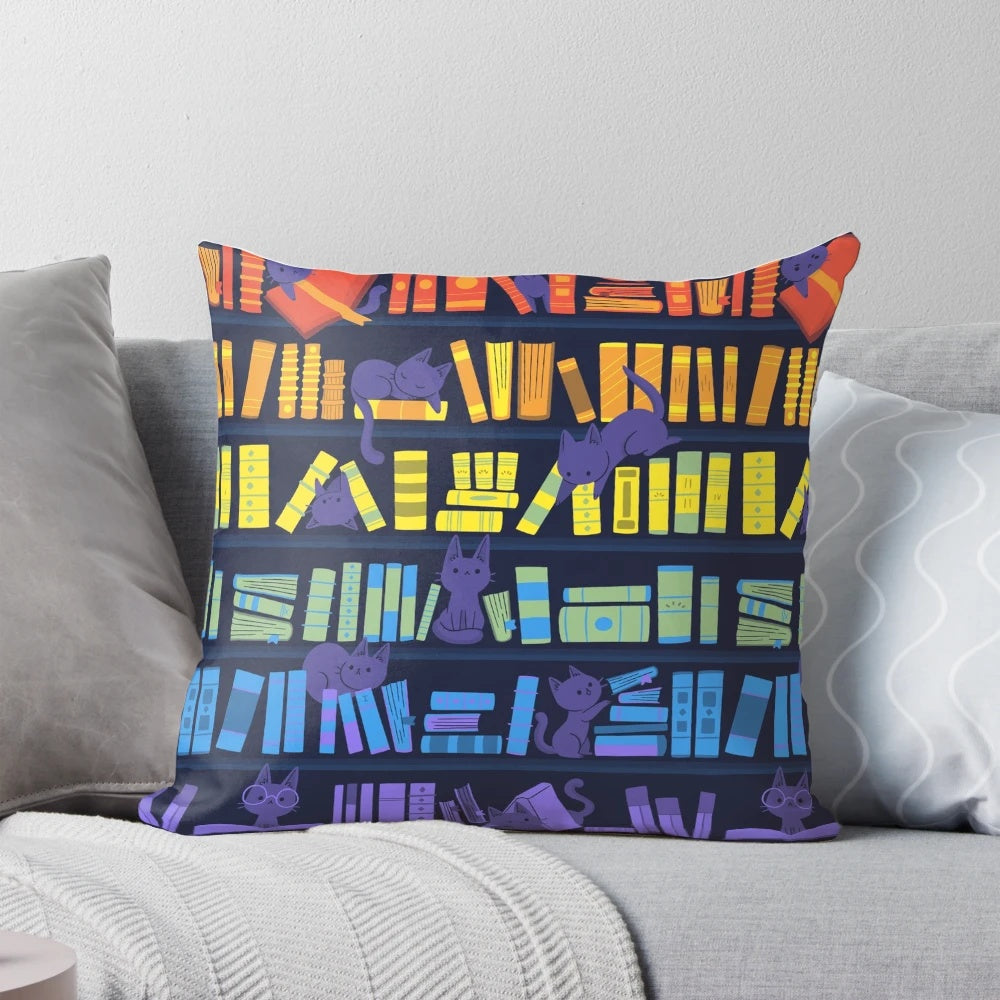 Soft, colorful pillow featuring two adorable kittens sitting among books and a rainbow