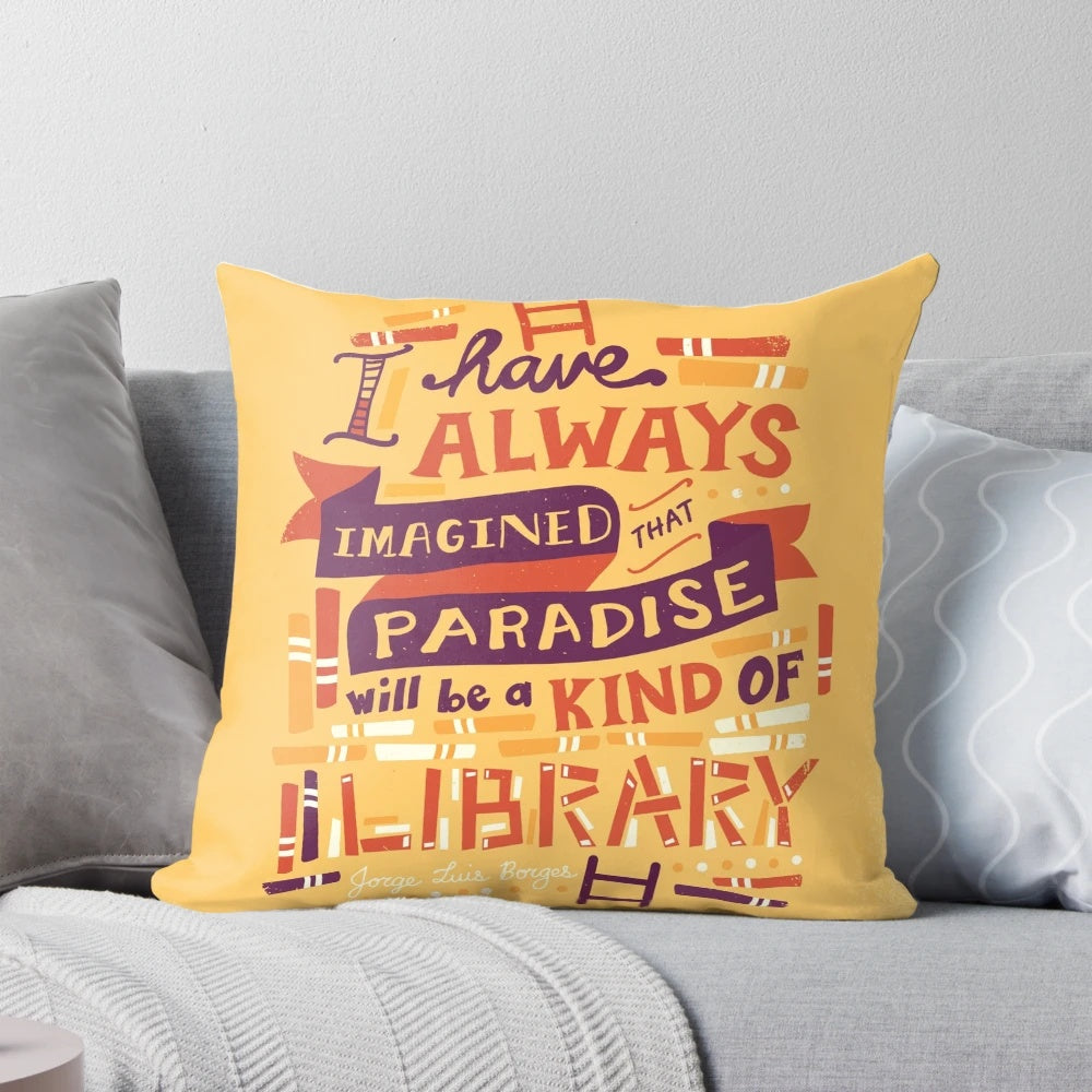 Soft, hand-lettered library pillow with open books and typography