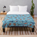 Light blue plush blanket with various shark species pattern