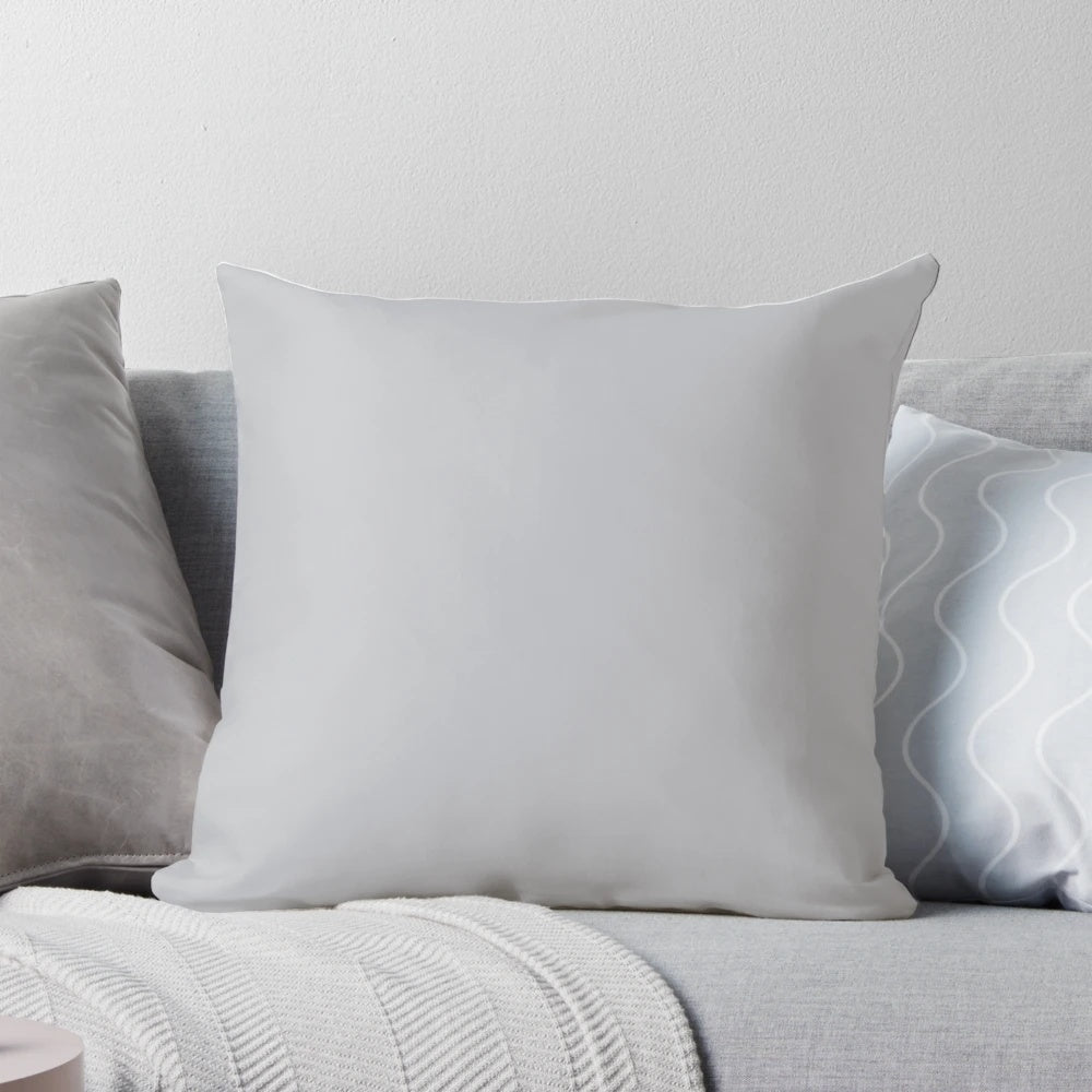 Soft, textured light gray pillow in a solid, simple design for comfortable home decor.
