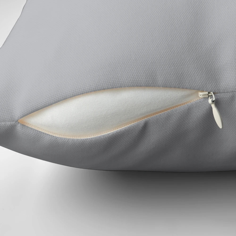 Soft, textured light gray pillow in a solid, simple design for comfortable home decor.