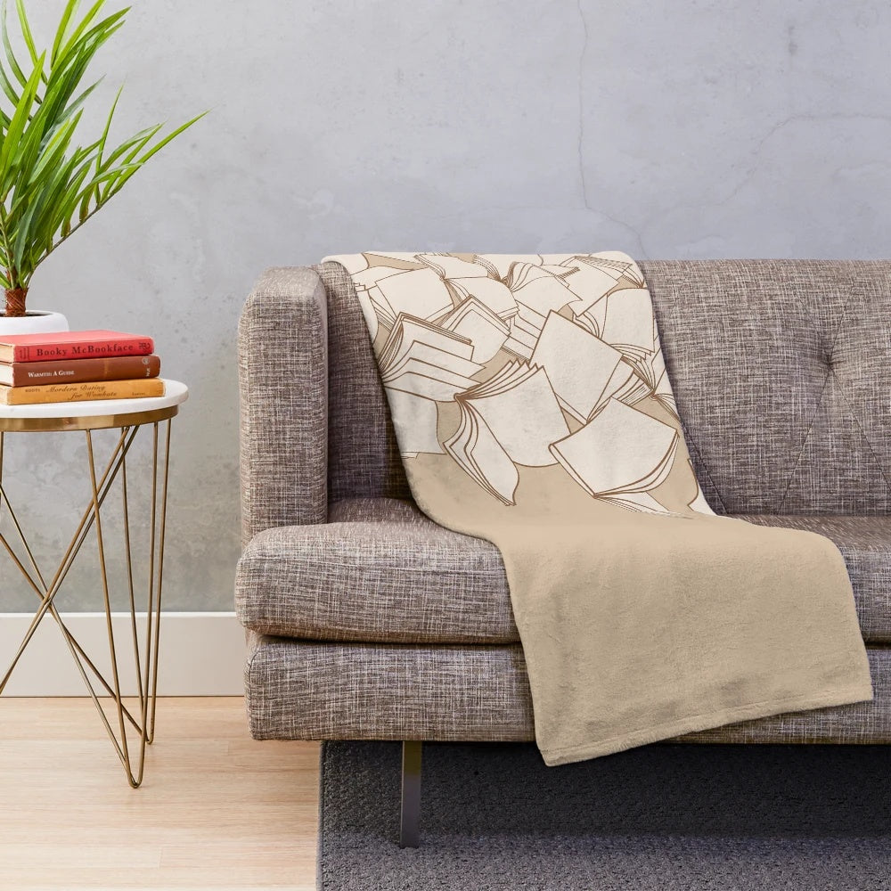 Cozy plush blanket with a books and reading-themed design