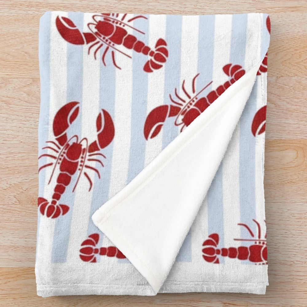 Soft and plush lobster-themed blanket in a blue and white striped design