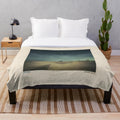 Lonesome Dreams plush blanket featuring the album cover art of Lord Huron's folk/indie album