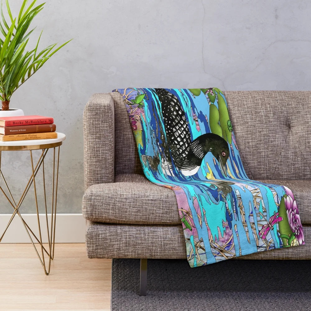 Loons and water lilies printed on a soft, plush blanket