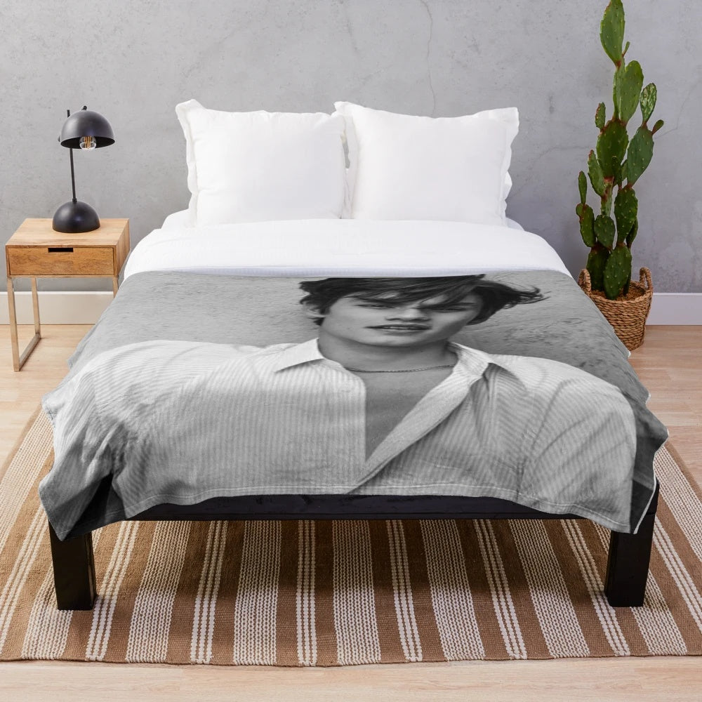 Soft, black and white plush blanket featuring Louis Partridge, the popular Enola Holmes Netflix actor