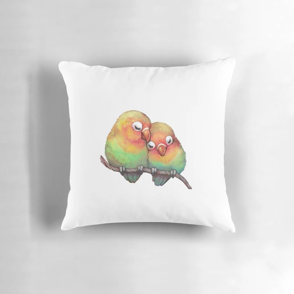Soft, plush lovebird pillow in shades of pink and red