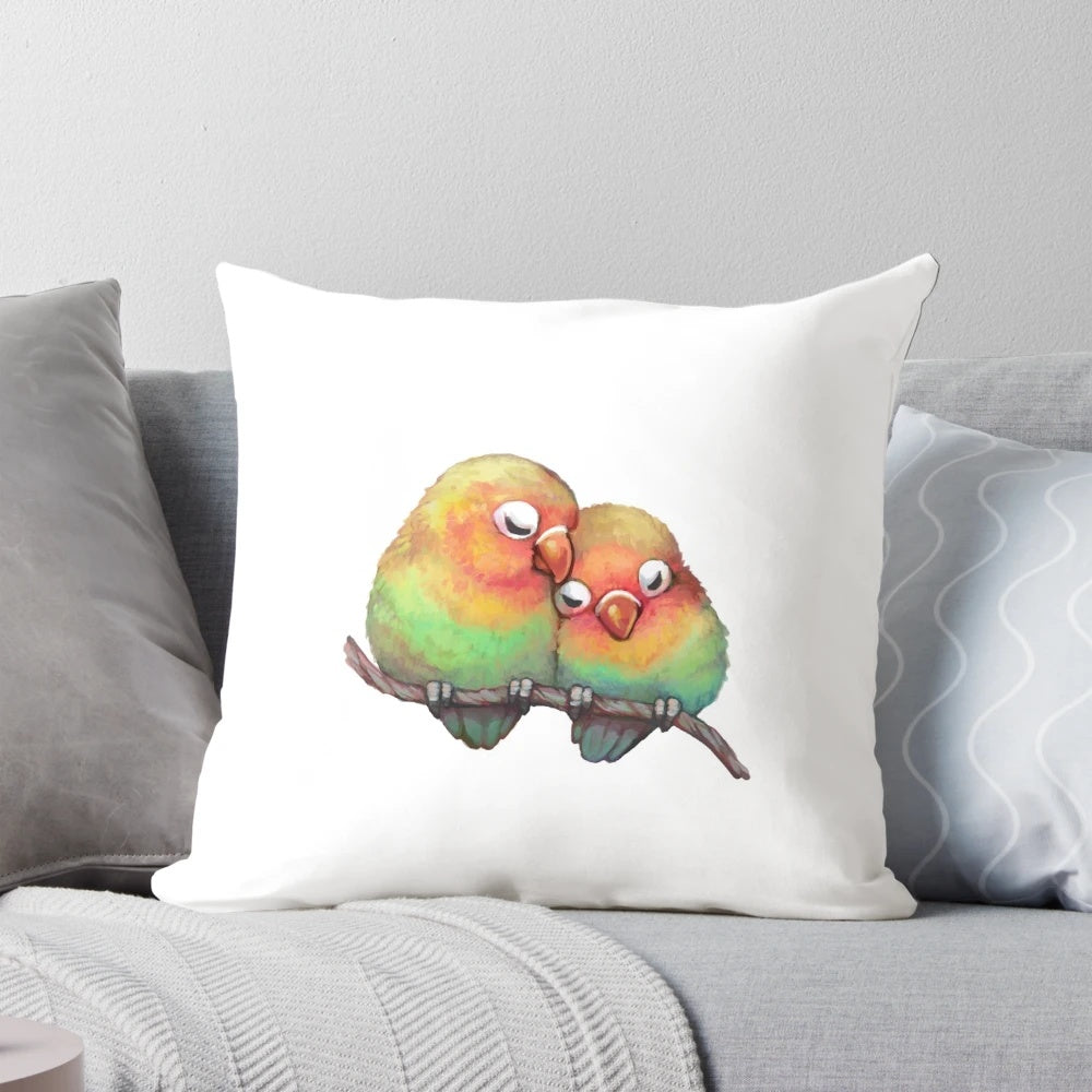 Soft, plush lovebird pillow in shades of pink and red