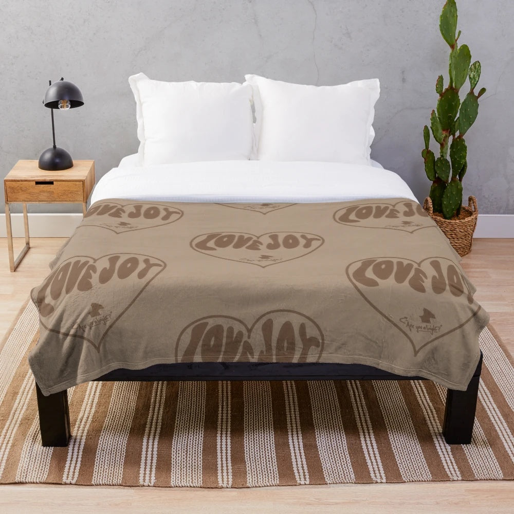 Lovejoy-inspired plush blanket featuring neutral colors and a cozy design