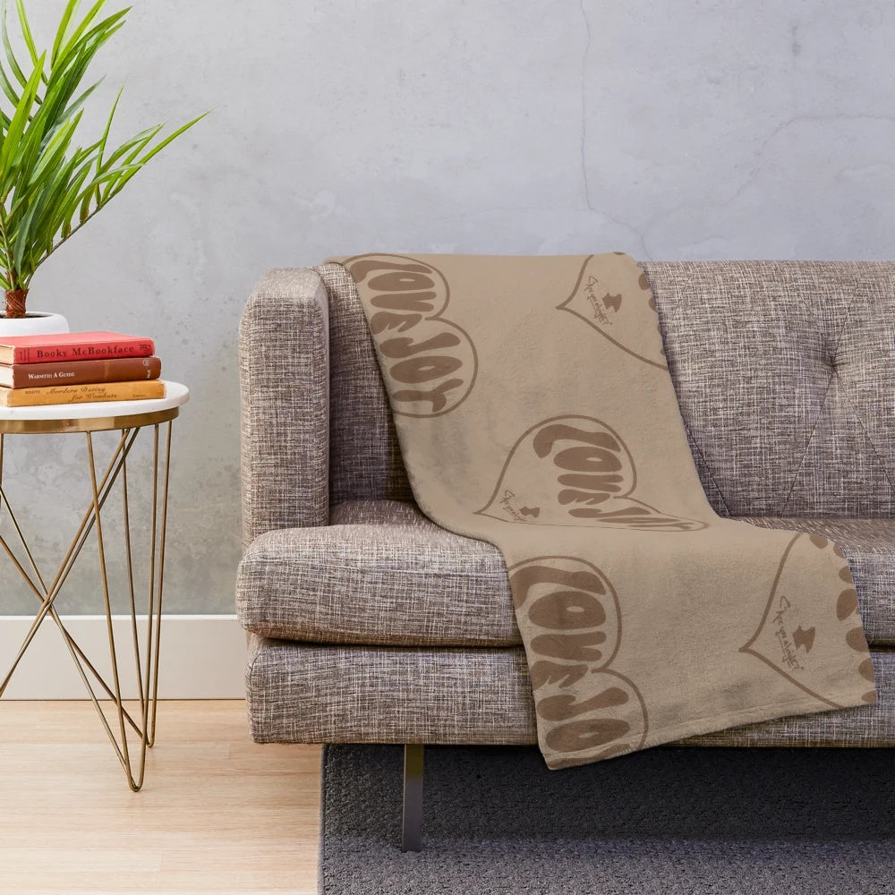 Lovejoy-inspired plush blanket featuring neutral colors and a cozy design