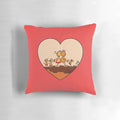 A plush pillow featuring a loving family of adorable frogs, perfect for home decor.
