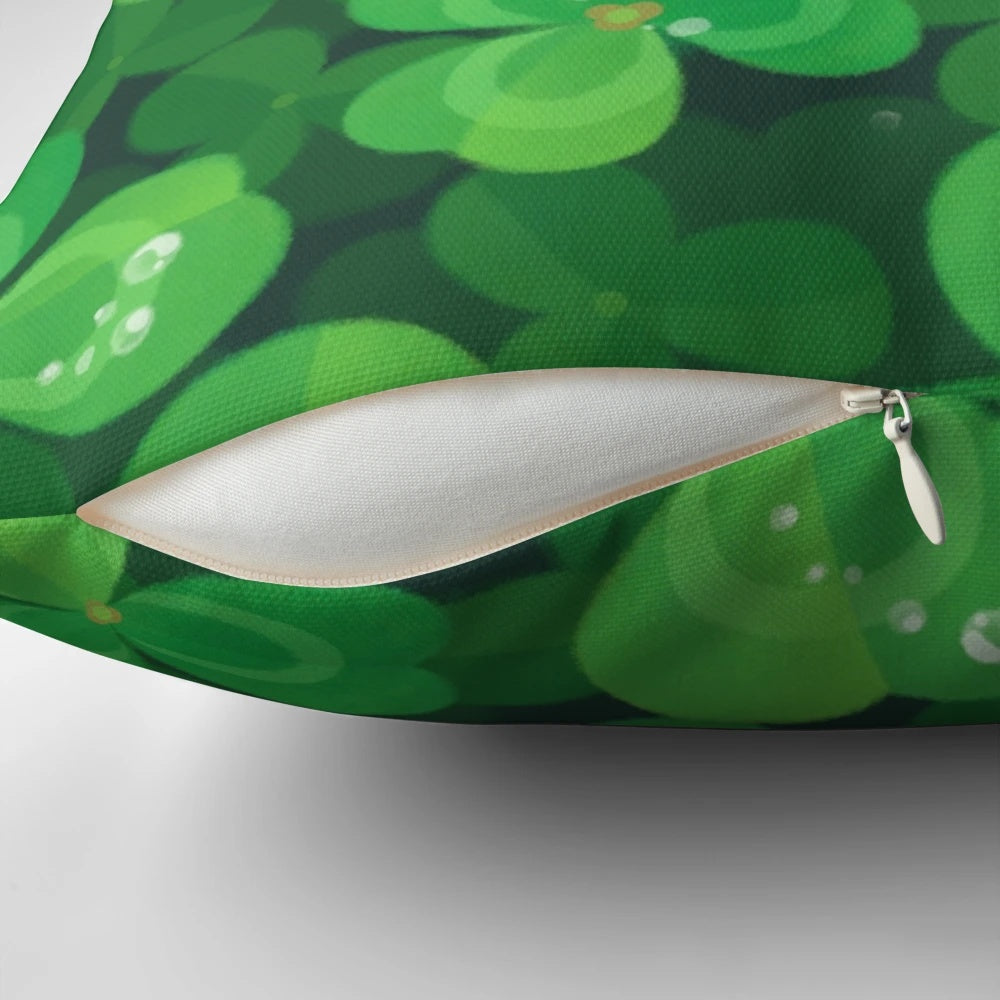 A soft, plush pillow featuring a happy, smiling snail sitting on a 4-leaf clover