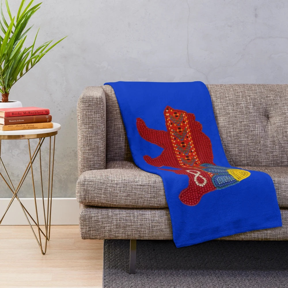 Métis bear plush blanket with floral design and beadwork sash