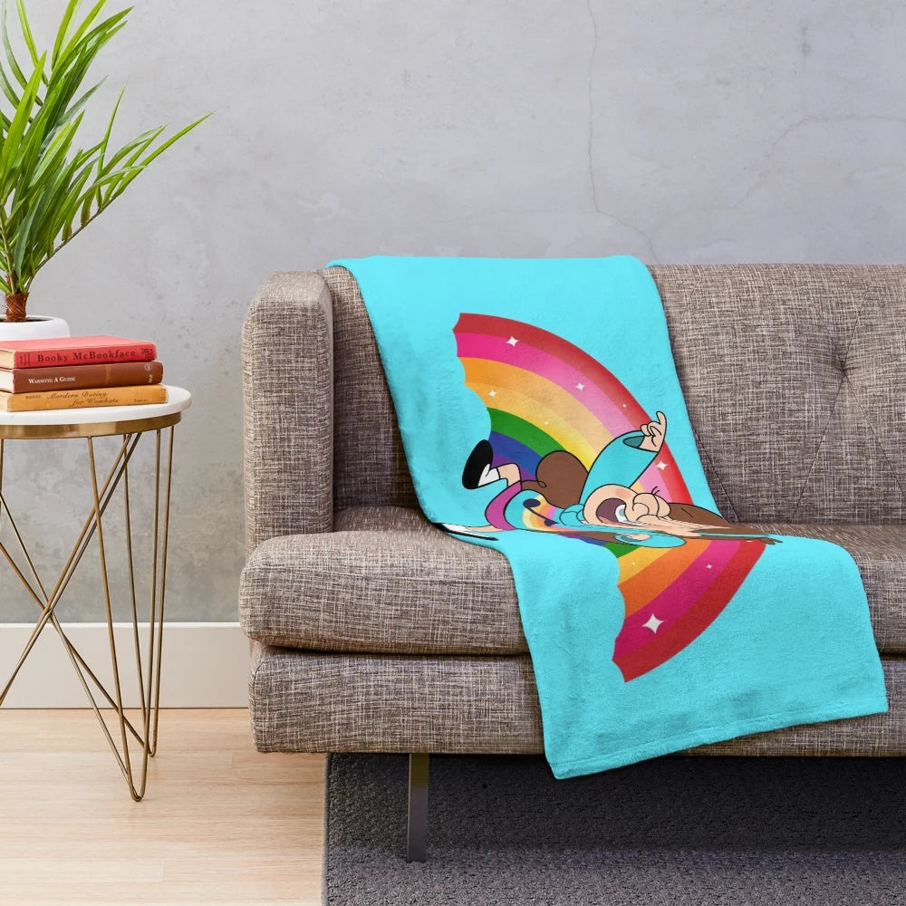 Mabel Pines, the energetic teenager from Gravity Falls, dancing on a rainbow background on a plush blanket.