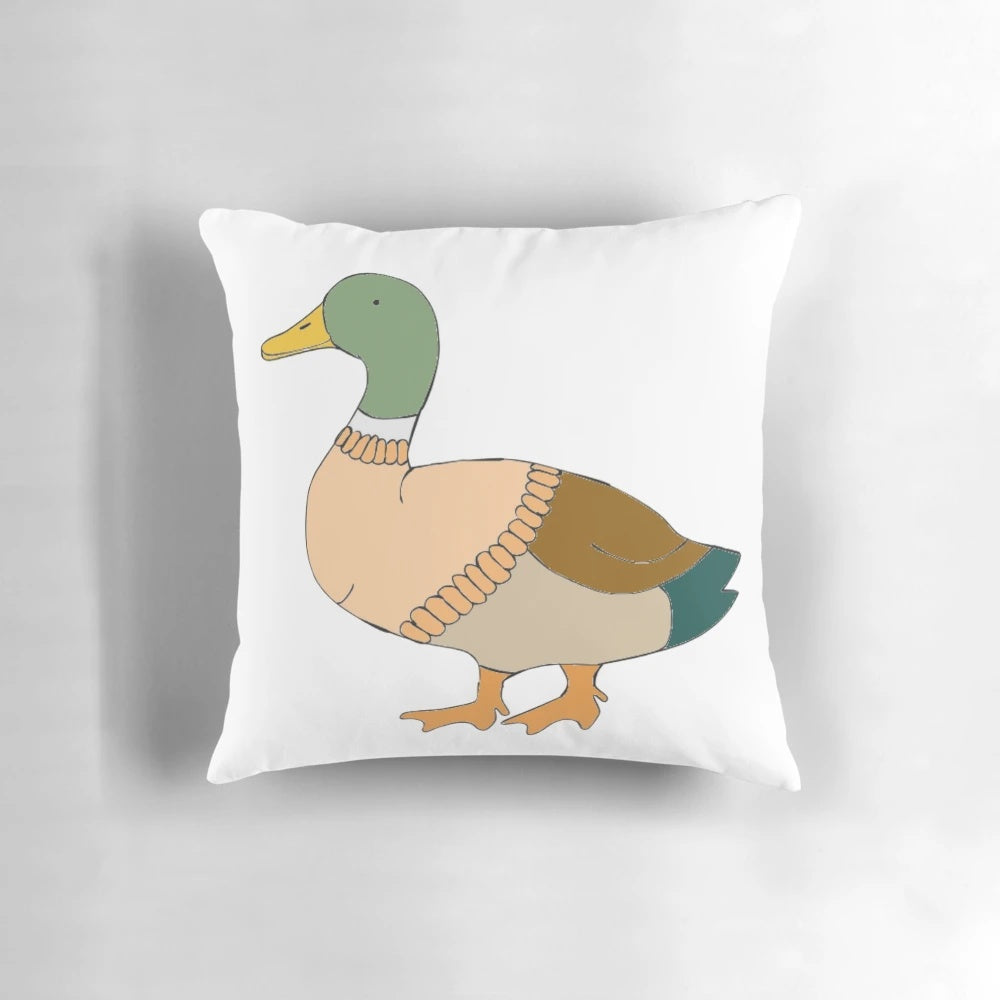 Decorative pillow featuring a mallard duck wearing a knitted sweater