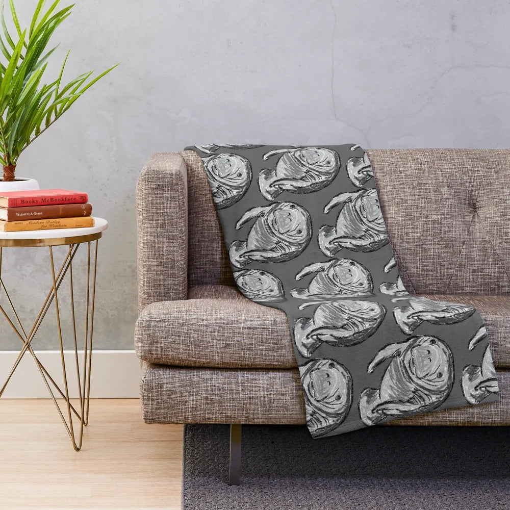 Soft and plush blanket featuring a detailed artwork of a manatee