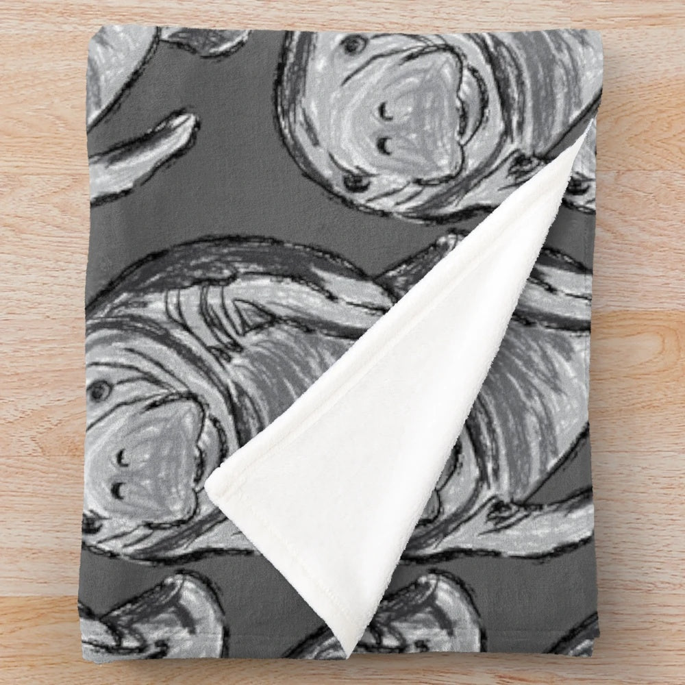 Soft and plush blanket featuring a detailed artwork of a manatee