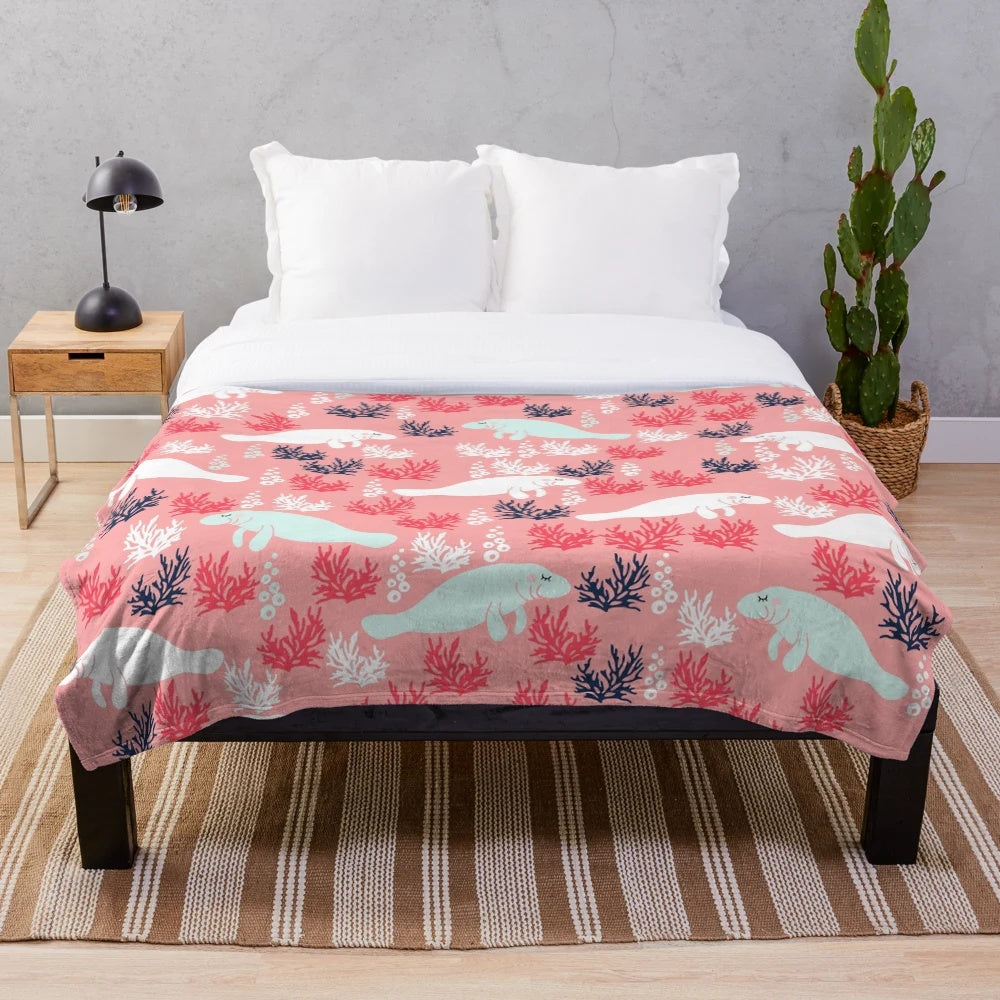 Soft, plush manatee-themed blanket with underwater seascape pattern