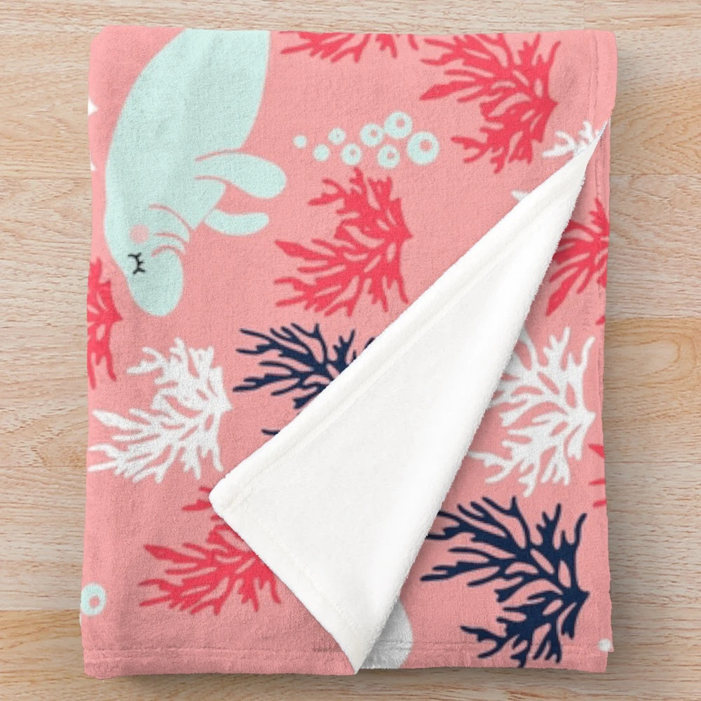 Soft, plush manatee-themed blanket with underwater seascape pattern