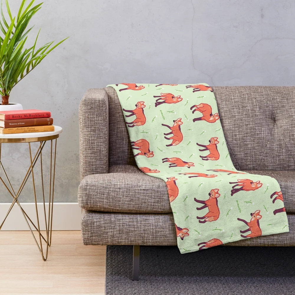 Maned wolf plush blanket with a repeating pattern design