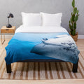 Manta ray swimming in the blue ocean plush blanket