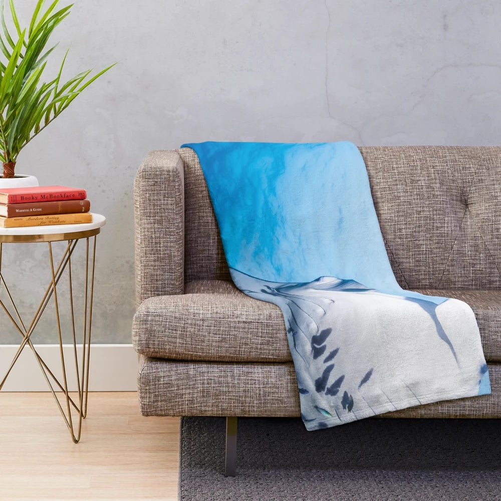 Manta ray swimming in the blue ocean plush blanket