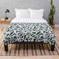 Maori paua plush blanket with intricate indigenous design
