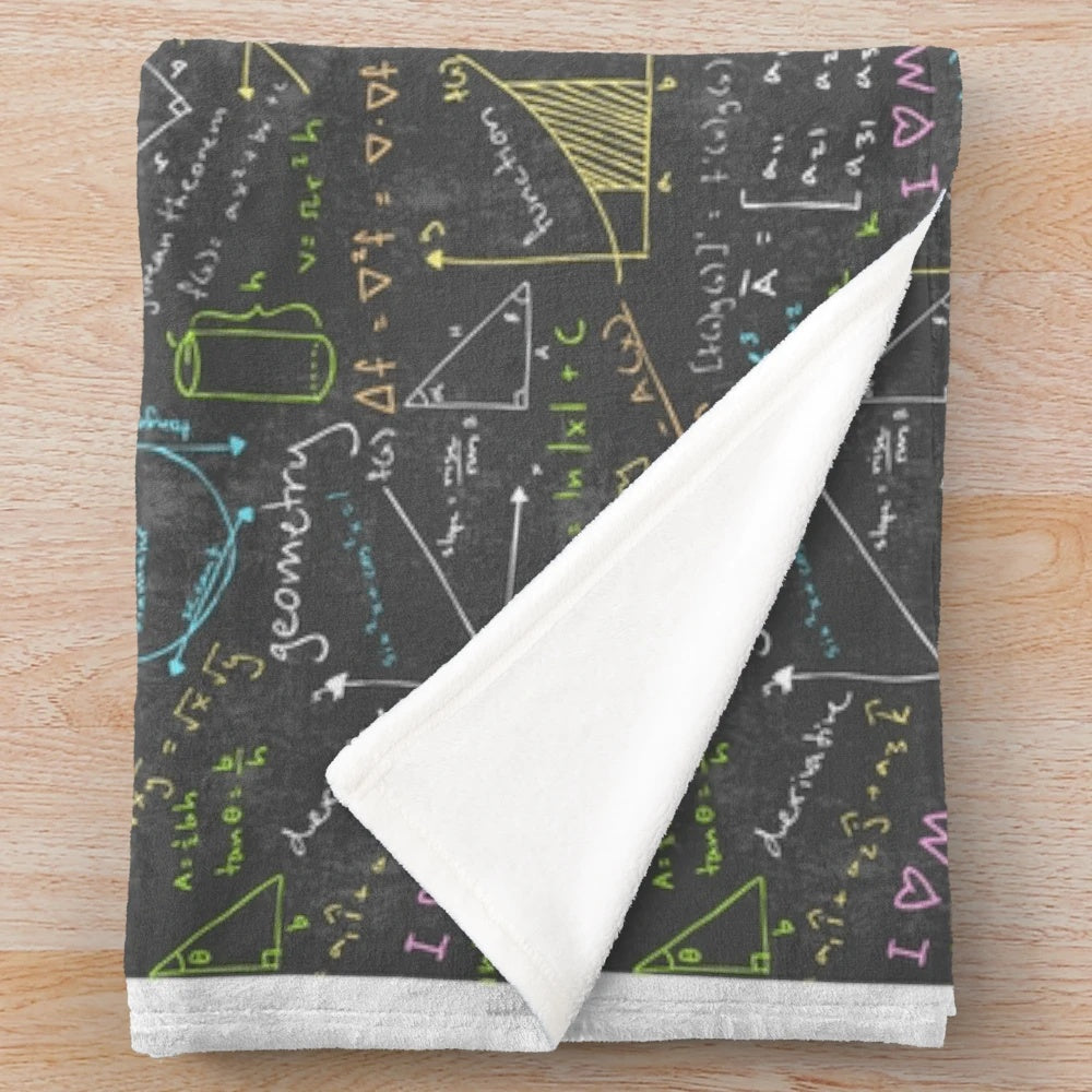 Cozy math lessons plush blanket featuring chalkboard designs and mathematical elements