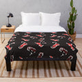 Maws Plush Blanket with a wolf-themed design featuring canine teeth and fur