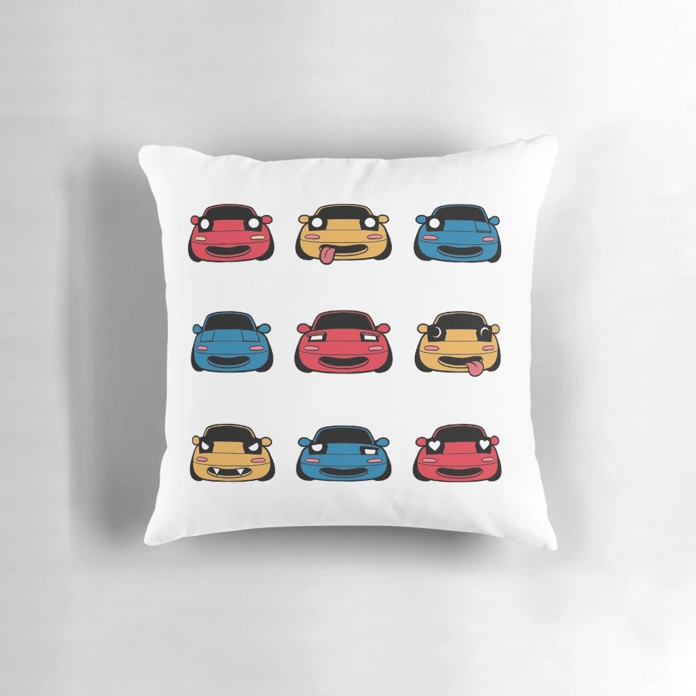A decorative pillow featuring the many faces of the beloved Mazda Miata/MX5 sports car