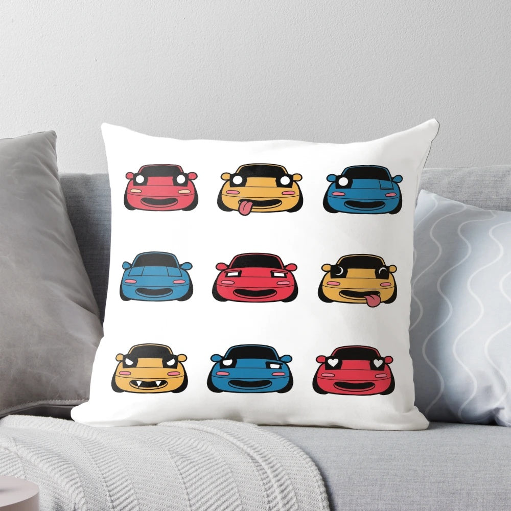A decorative pillow featuring the many faces of the beloved Mazda Miata/MX5 sports car